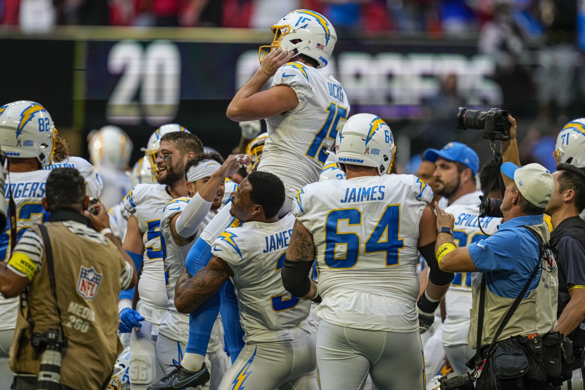 Chargers players lift kicker Cameron Dicker on their shoulders after a game-winning kick to beat the Falcons